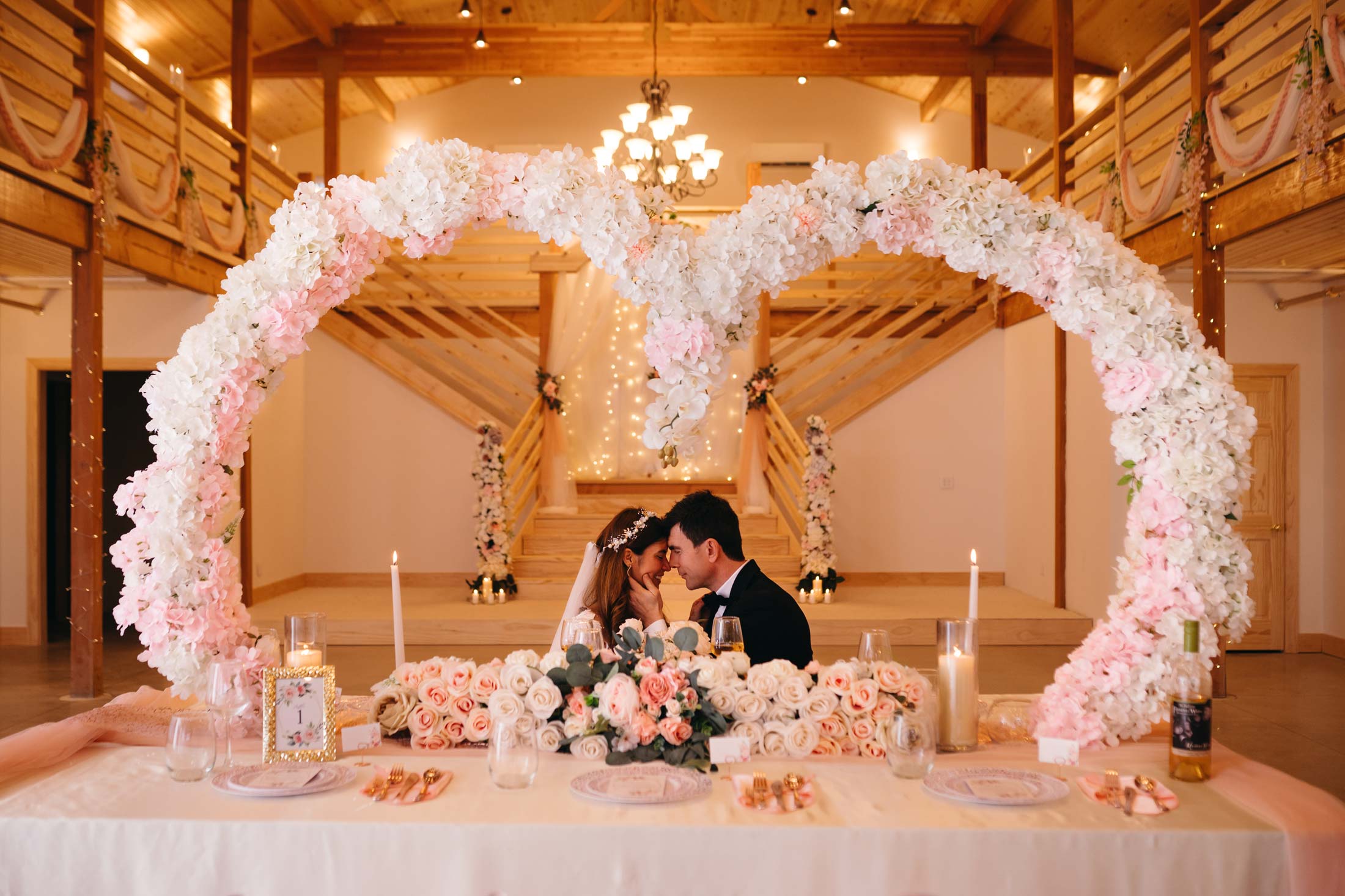 couple under decorated wreath